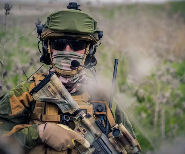 age-uniform-holding-an-assault-rifle