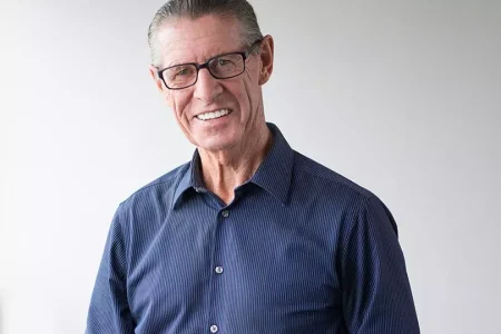 nior-man-wearing-glasses-smiling-at-