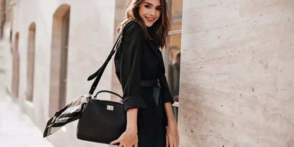 smiling-against-light-building-wall